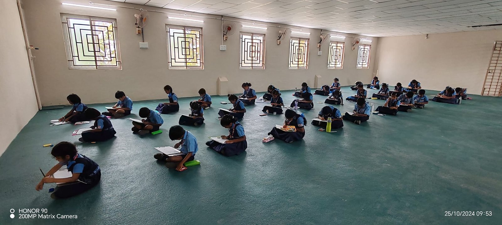 Science laboratory with students conducting experiments, microscopes and equipment on benches, focused learning